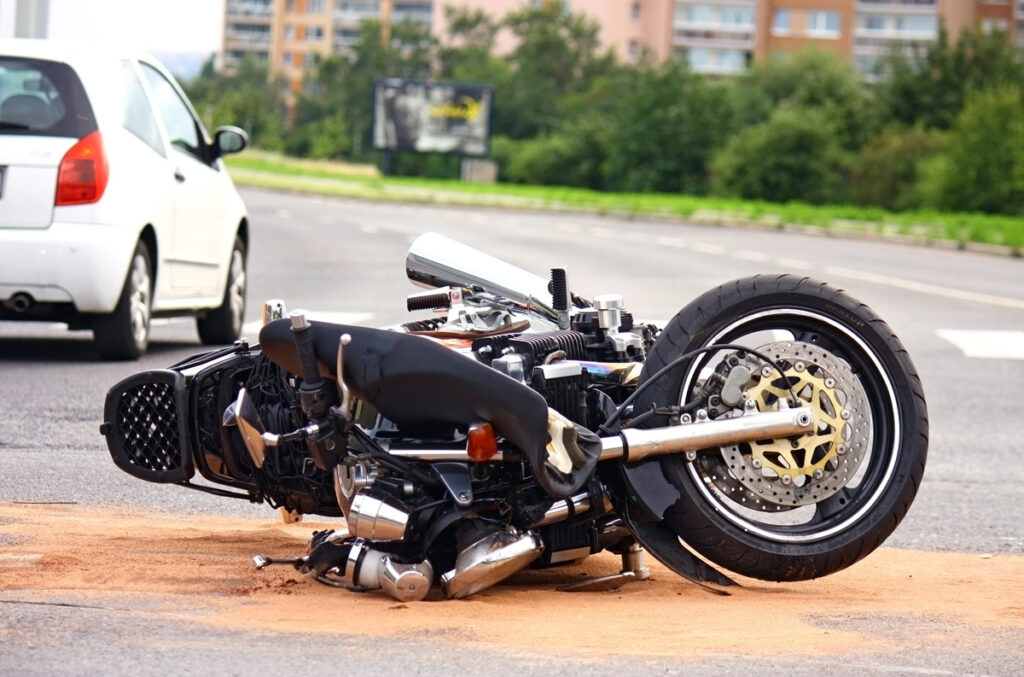 A motorcycle lying on the ground on a street after an accident in Hobbs.