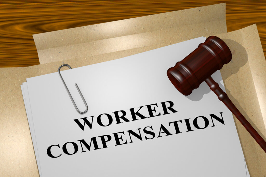 A piece of paper that says “WORKER COMPENSATION” in black with a gavel next to it.