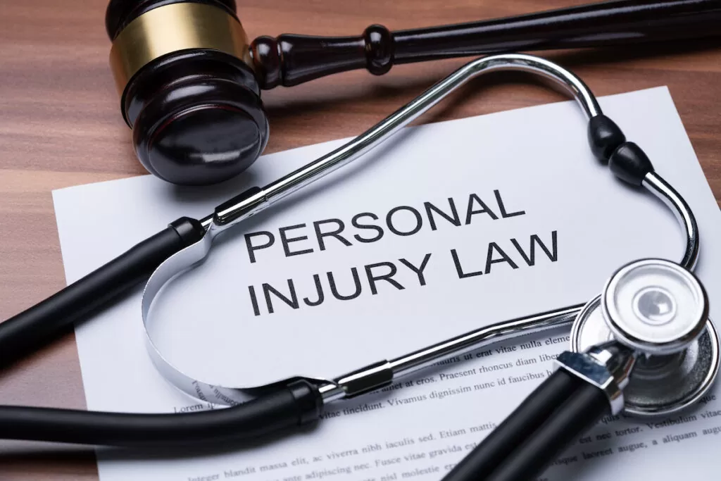 Elevated View Of Gavel And Stethoscope On Paper Of Personal Injury Law